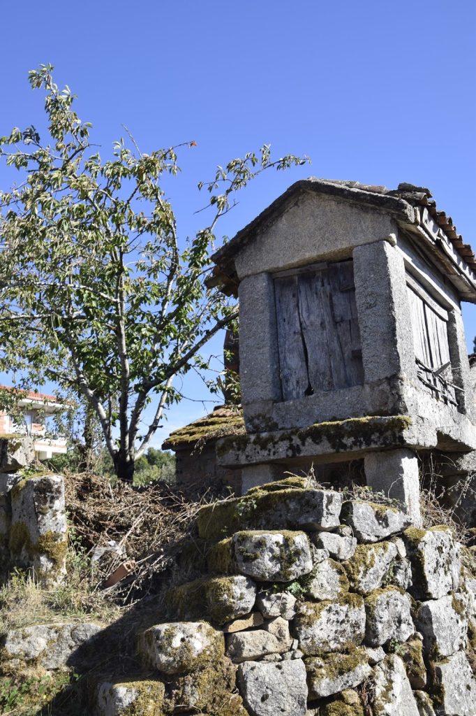 Stone granary beneath a blue sky